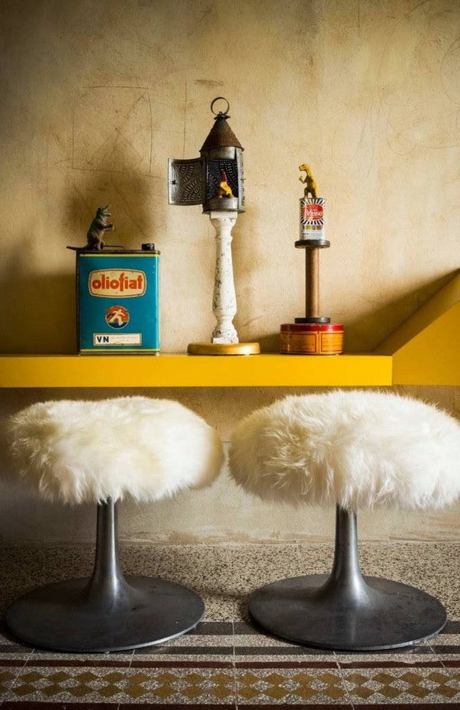 sheepskin yellow room with sheepskin stools