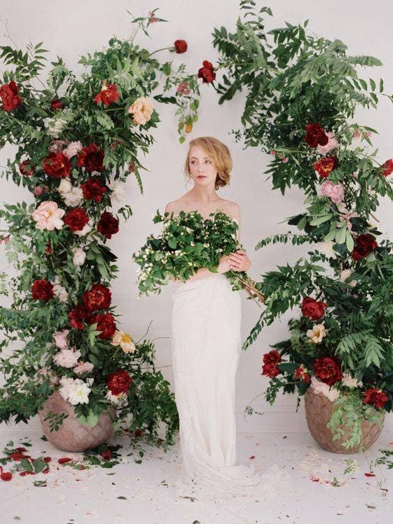 red wedding ideas green and red floral wedding alter