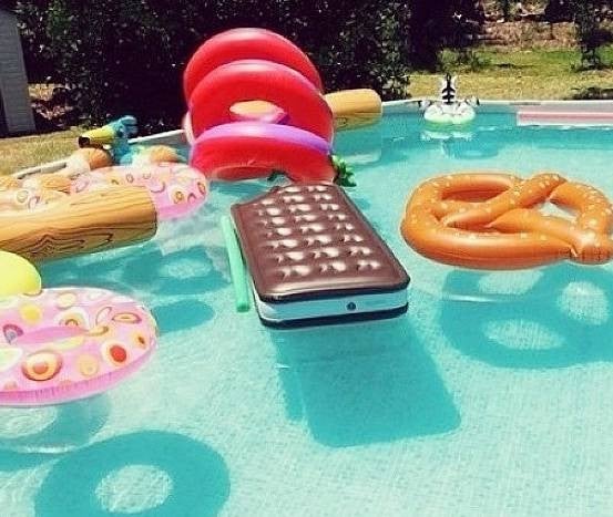 Fun Summer Friday Ideas pool filled with inflatables
