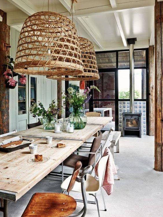 boho interior design long dining table with large pendant lamps