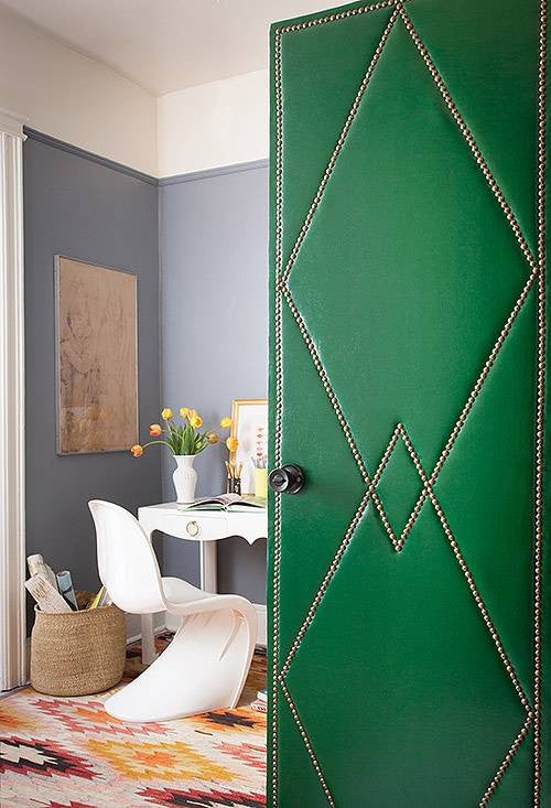 painted door upholstered door with nailhead trim