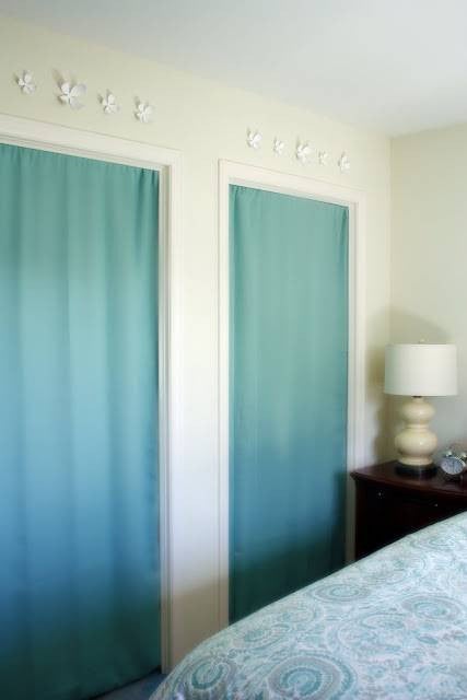 painted door curtains covering ugly door