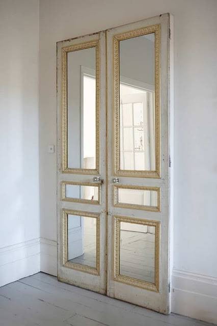 painted door mirrors in door windowpanes