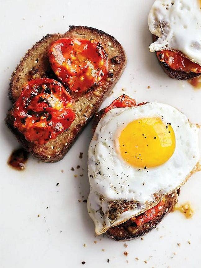 Charred Tomatoes with Fried Eggs on Garlic Toast