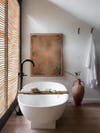 Bathroom tub with wooden caddy