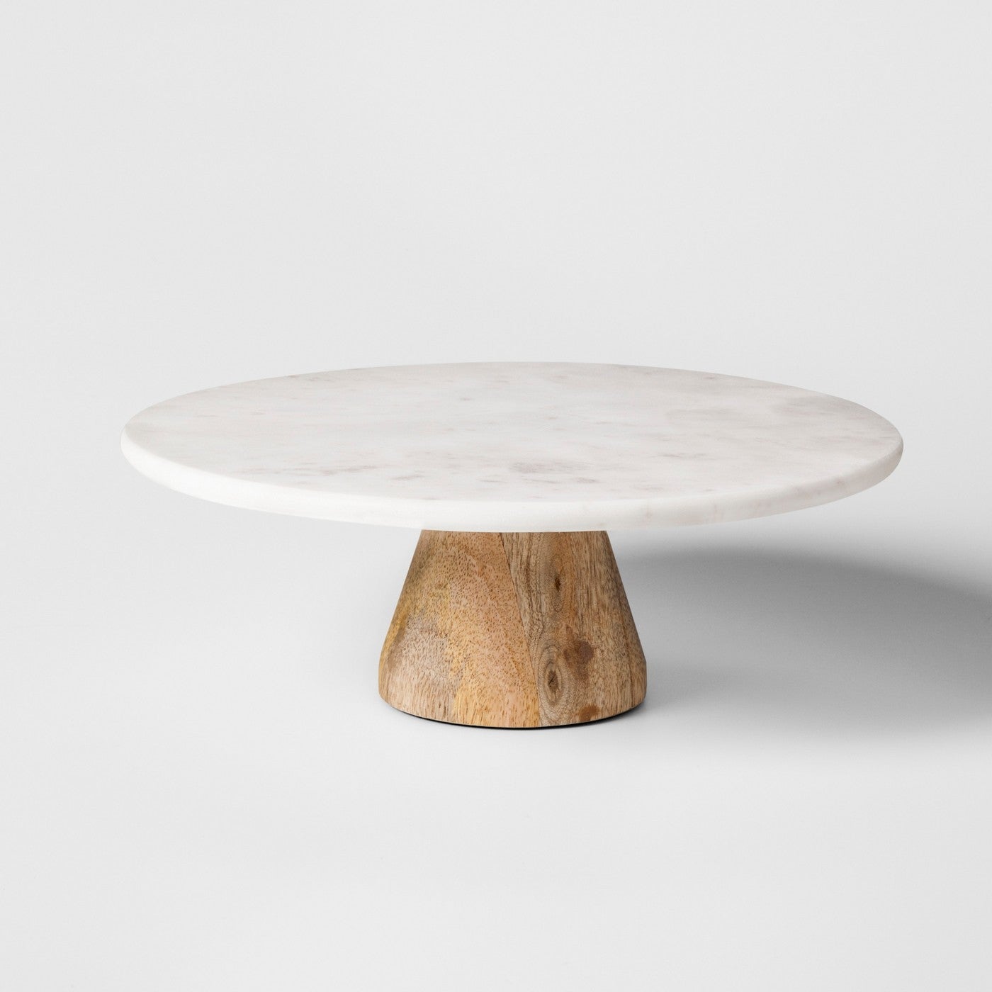 marble and wood cake stand