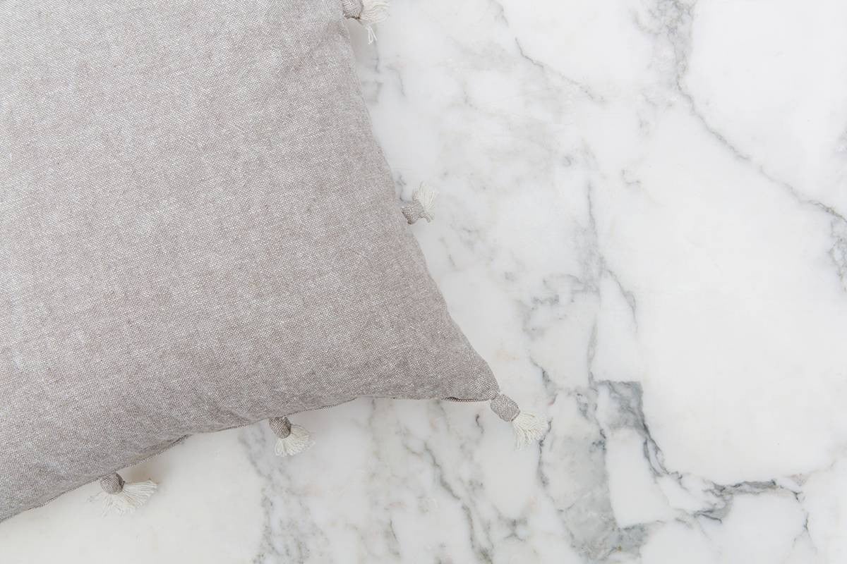 diy pillow tassels pillow on marble