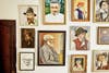 Wall full of old fashioned portait paintings