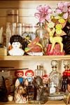 Assortment of tchotchkes and dishes on shelves