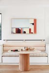 breakfast nook banquette with cream bolsters
