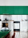 green kitchen cabinets with stainless steel counters