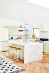 mint green kitchen with colorful pendant lights