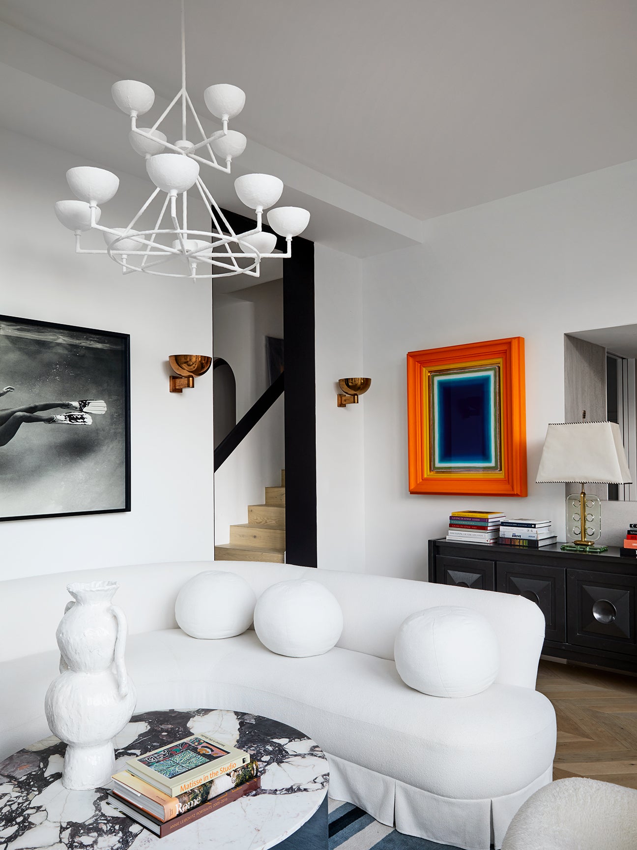 Sydney living room with white sectional and colorful art