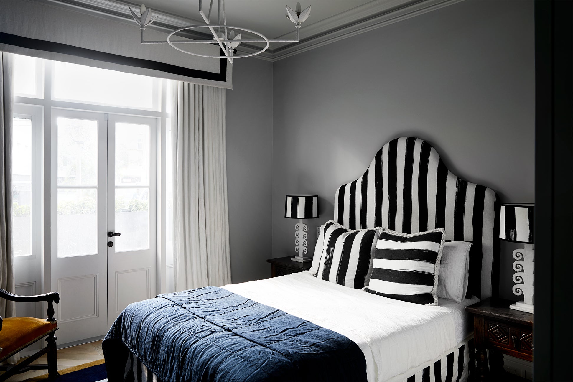 Sydney bedroom with gray walls and a striped bed