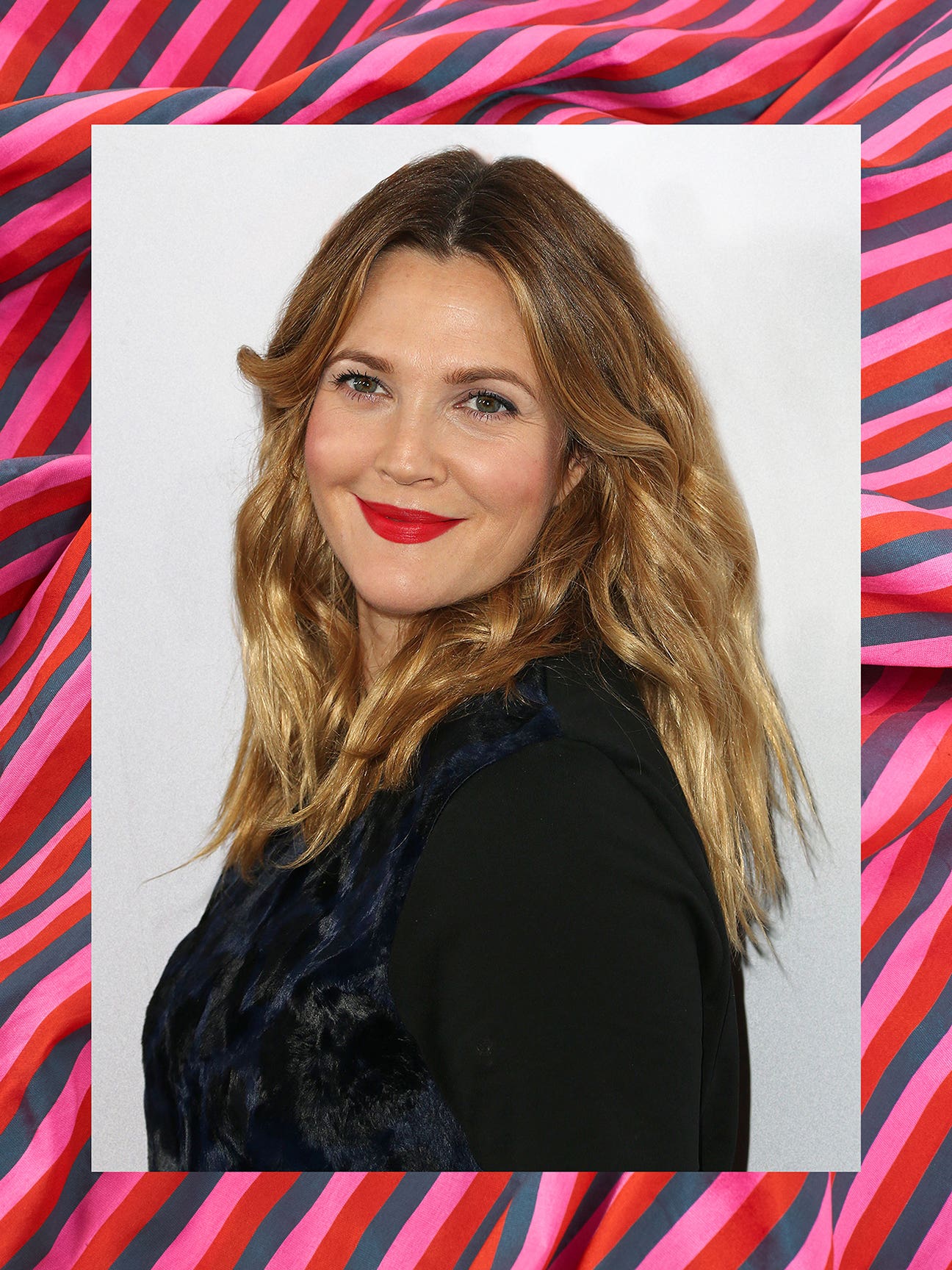 drew barrymore against a pink background
