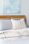 White and gray striped bedding