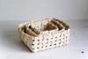 three woven baskets sitting inside one another