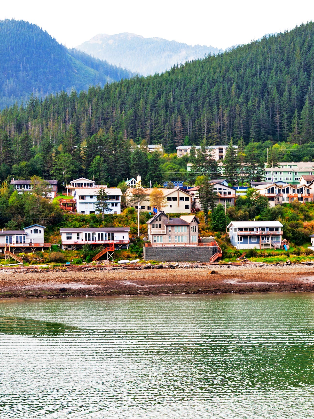 photo of junea alaska by a lake and mountains