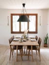 neutral dining room with farmhosue table and black pendant