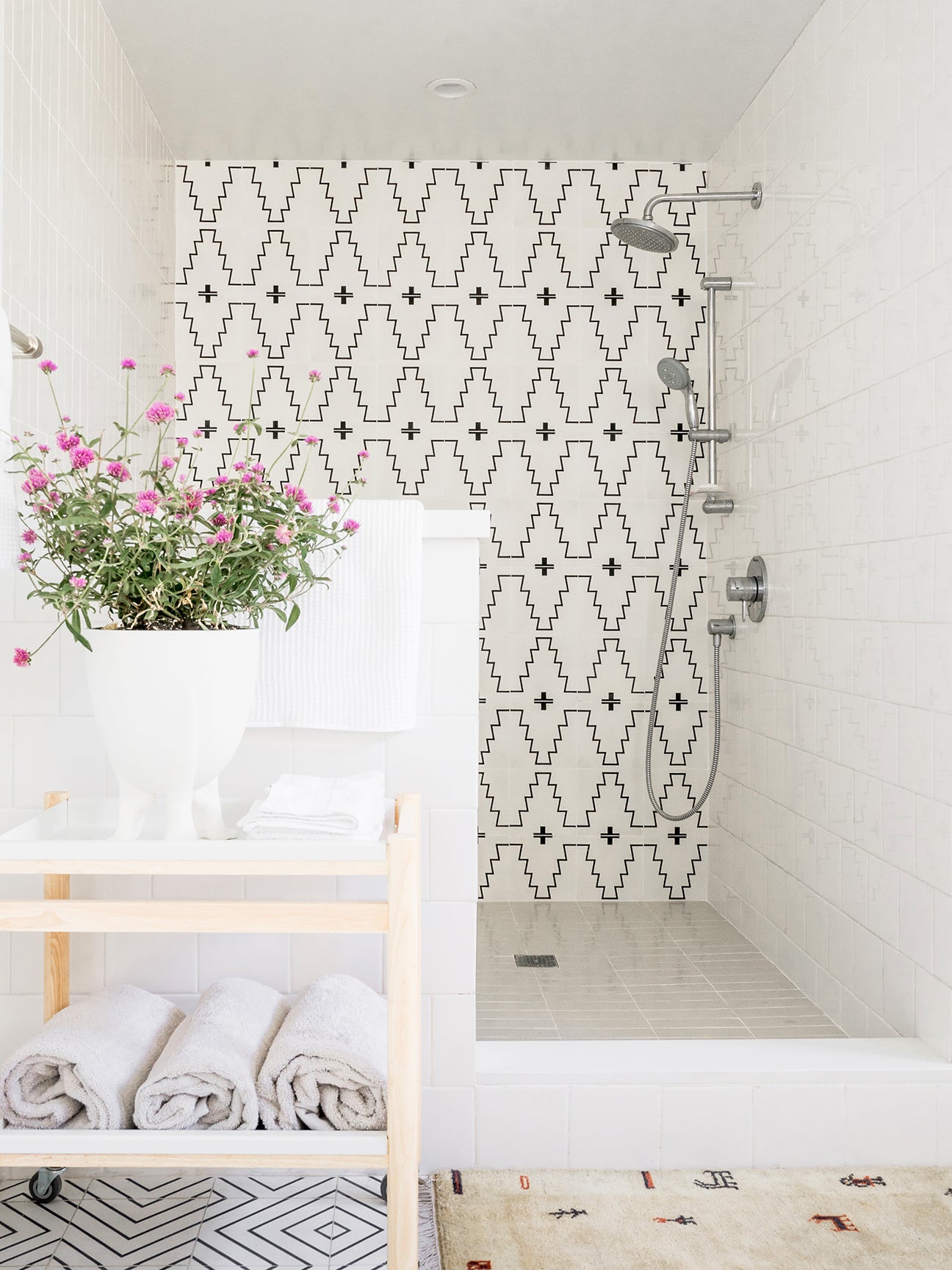 white shower with black and white western tiles