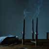 black taper candles on a table 