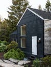 black cabin with white door
