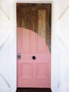 front door with a pink arc painted on it