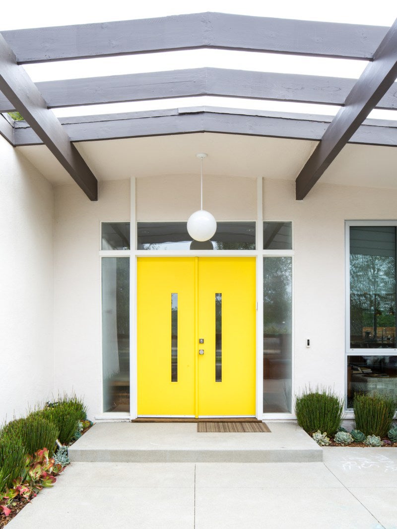 yellow door of a mid century home