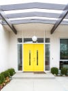 yellow door of a mid century home