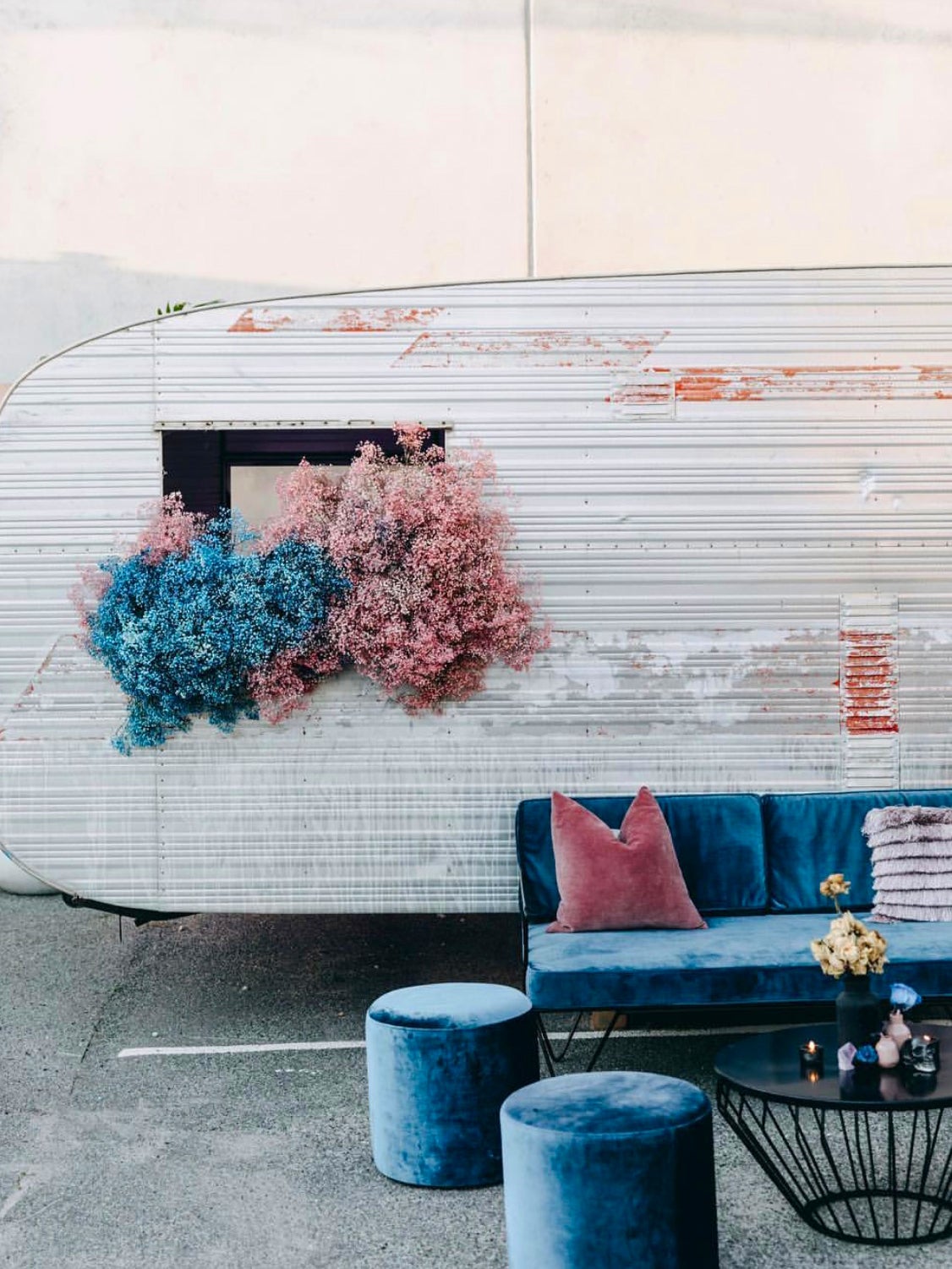 babys breath hanging out of a retro trailer window