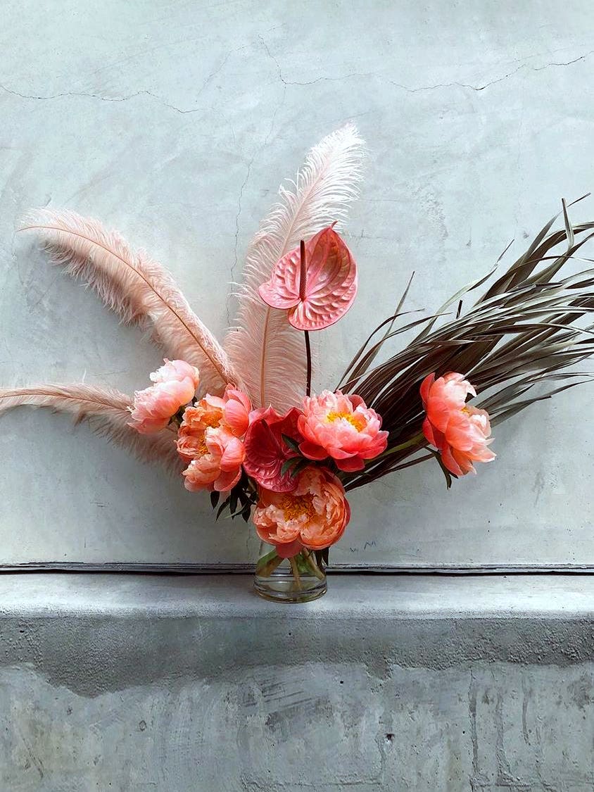 The Case for Adding a Feather to Your Flower Arrangement