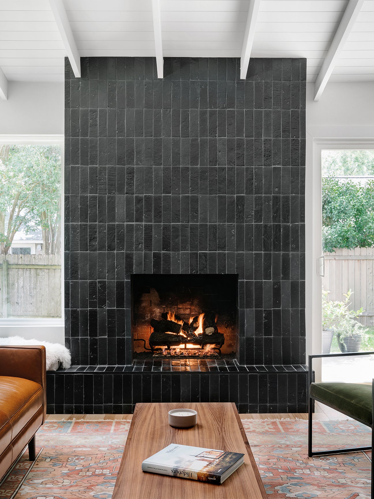 Beautiful fireplace design with black ceramic subway tile