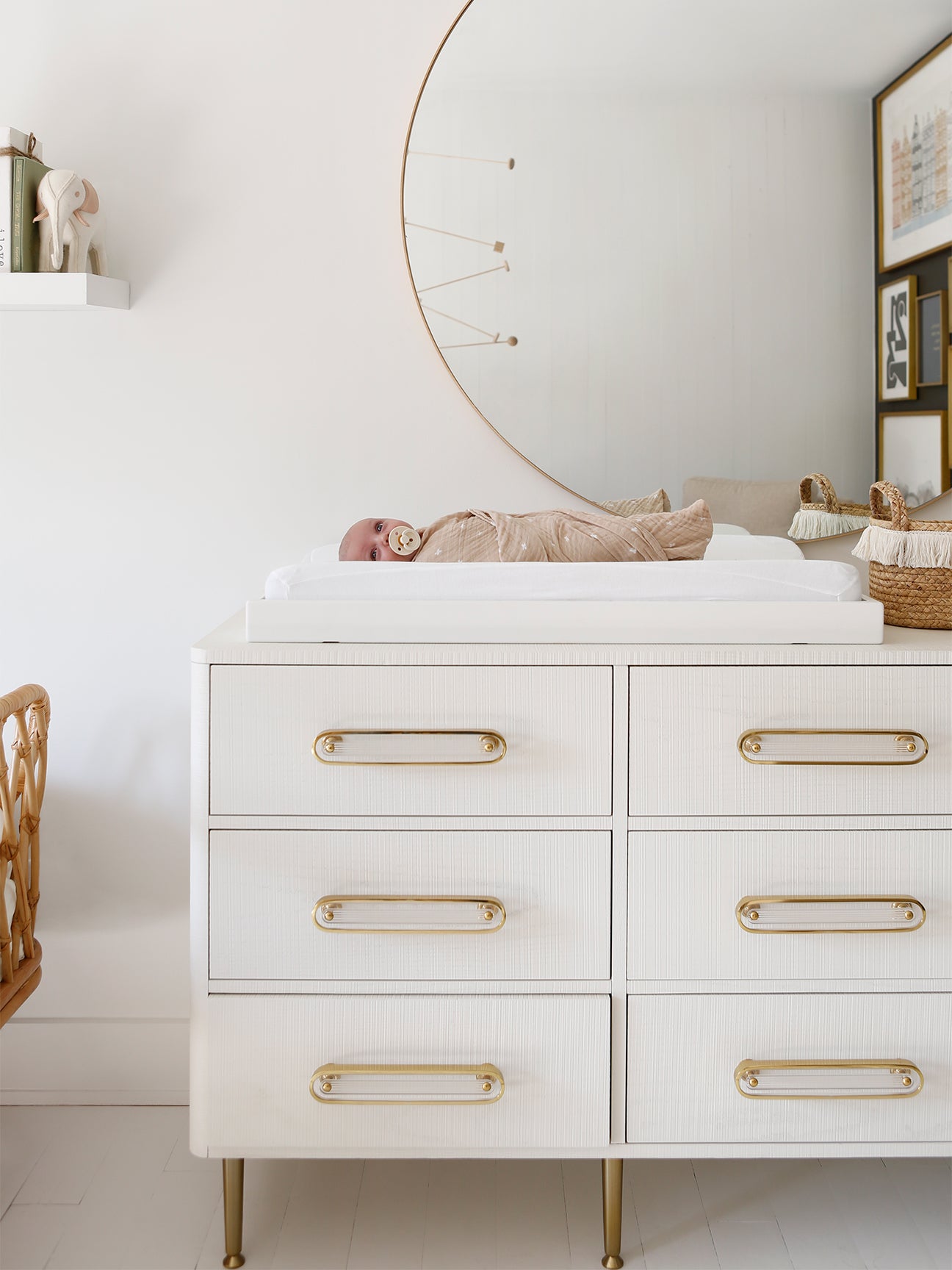 baby laying on a changing table