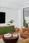 living room with a green media cabinet