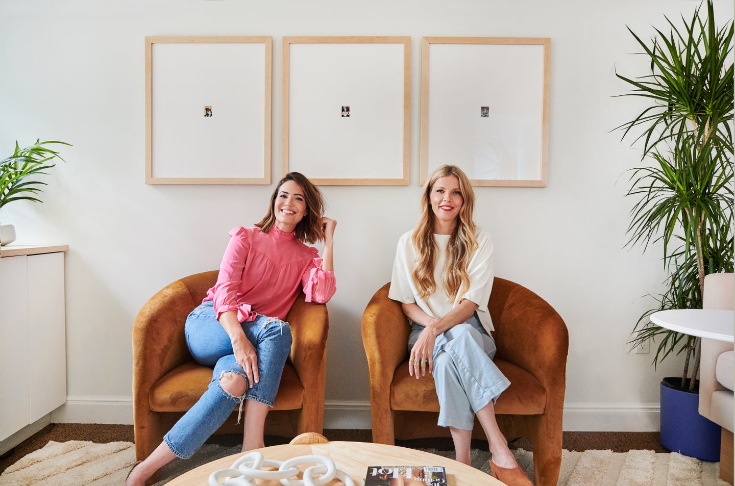 mandy moore and her designer sitting in matching armchairs