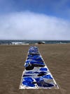 fabric strip laid out on the beach