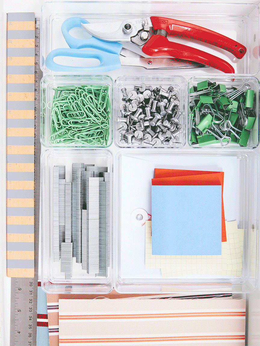 gif of office supplies going into a desk