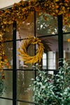 gold wreath on a glass paned front door