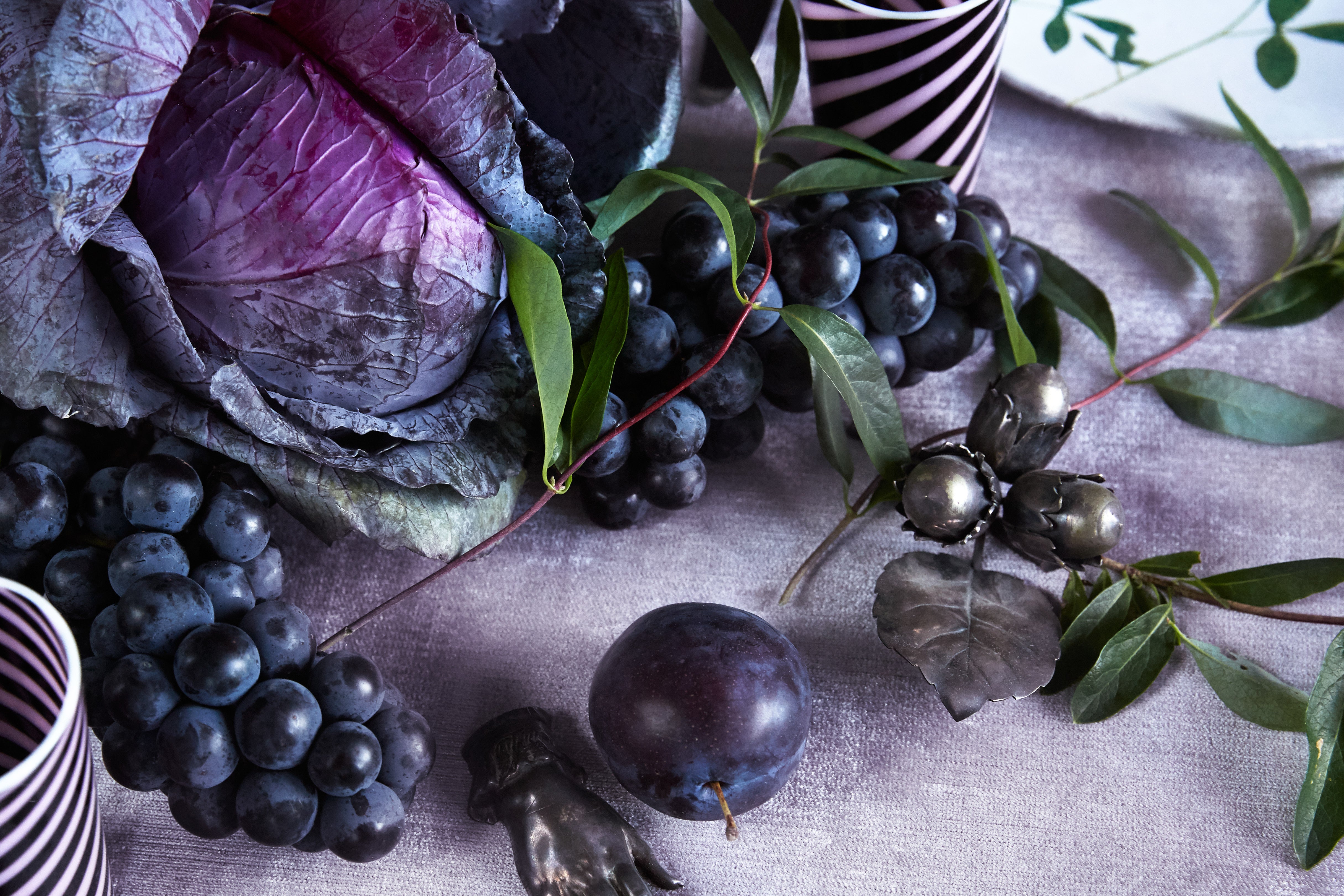 red cabbage surrounded by grapes