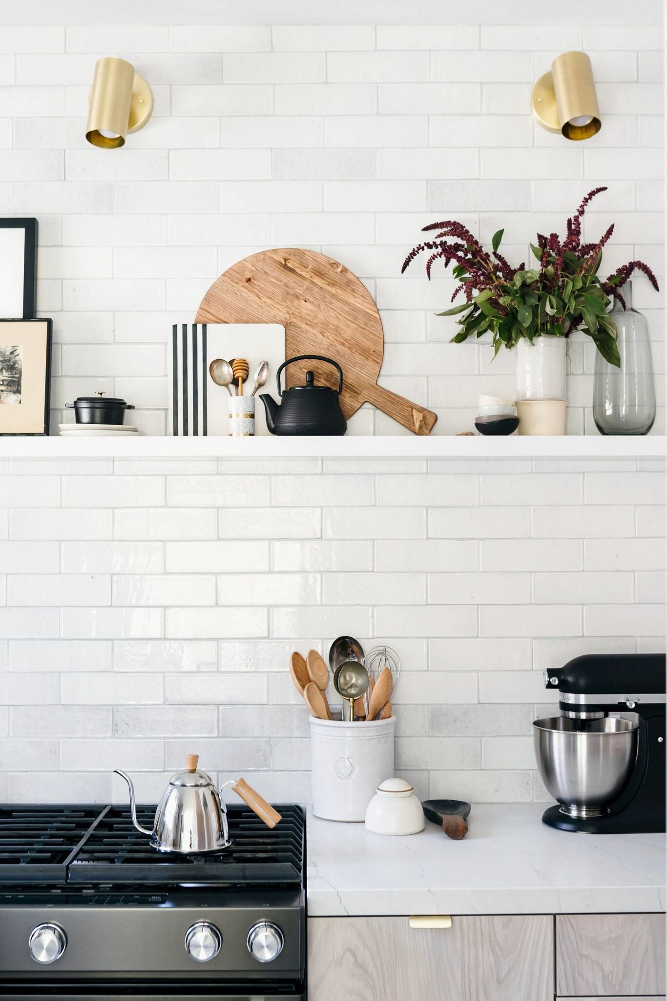 black and white kitchen with a kitchenaide on the counter