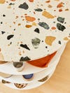 close up of orange and green terrazzo kitchen counters