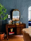 dark blue dining room with vintage wood bar