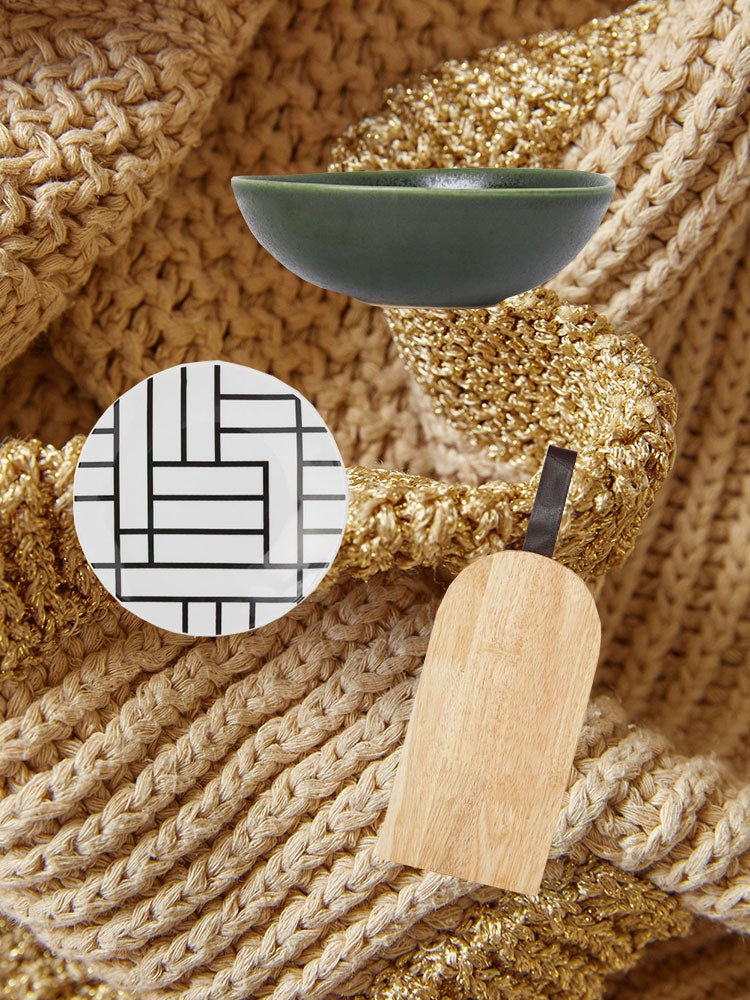 plates and bowls on a backdrop of sweater material