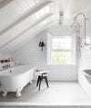 slanted roof with a tub and shower