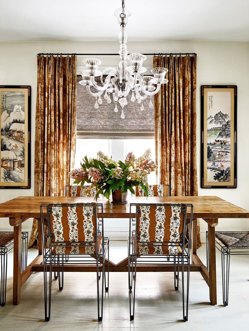 dining room with brown and white upholstered chairs