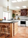 wood kitchen with a brown tiled range hood