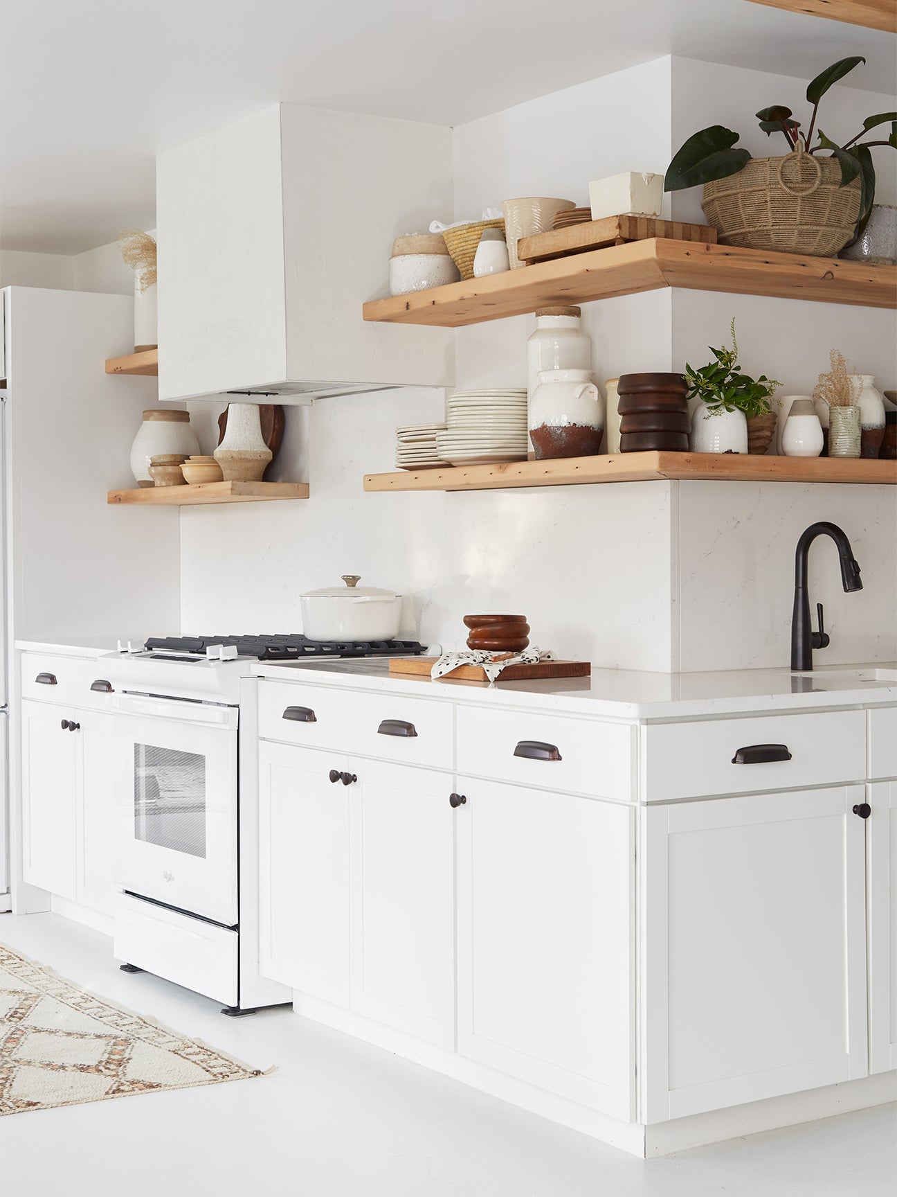 White kitchen with open shelving.