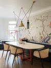 Dining room with floral wallpaper by Studio DB