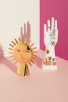 gold-sun-white-hand-sculptures