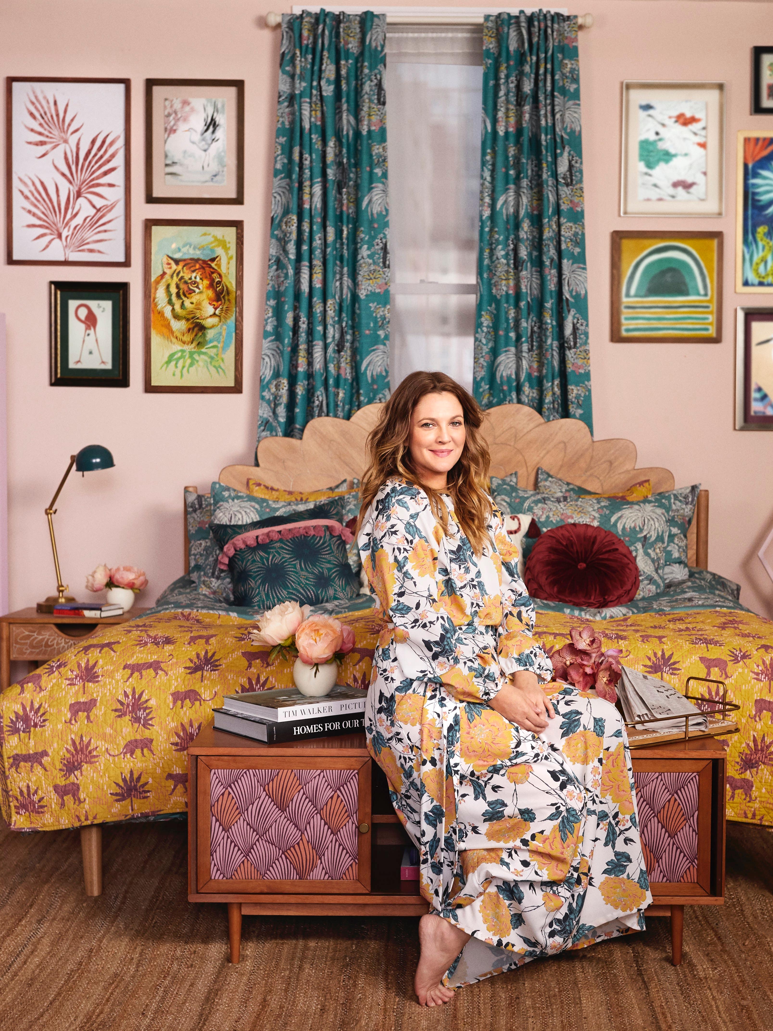 Drew Barrymore in a colorful room full of Flower Home decor.